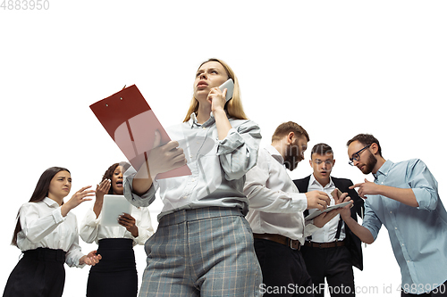 Image of Nervous tensioned investors analyzing crisis stock market with charts on screen of their gadgets