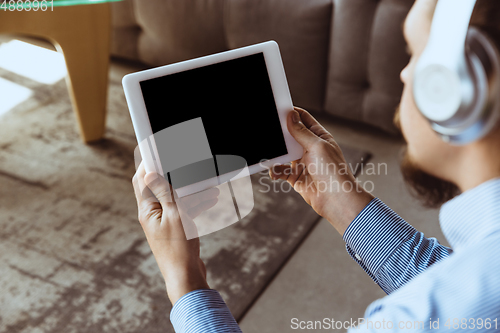 Image of Man working from home during coronavirus or COVID-19 quarantine, remote office concept.