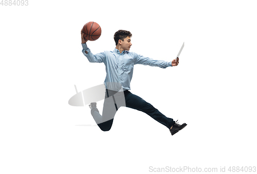 Image of Man in office clothes playing basketball on white background. Unusual look for businessman in motion, action. Sport, healthy lifestyle.