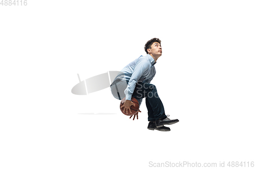 Image of Man in office clothes playing basketball on white background. Unusual look for businessman in motion, action. Sport, healthy lifestyle.