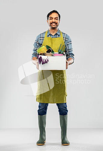 Image of indian gardener or farmer with box of garden tools