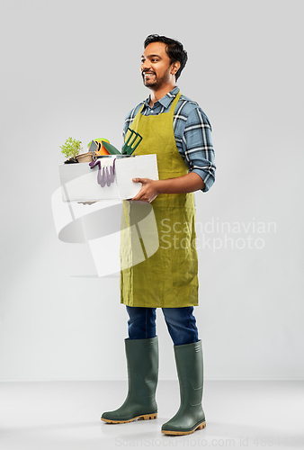 Image of indian gardener or farmer with box of garden tools