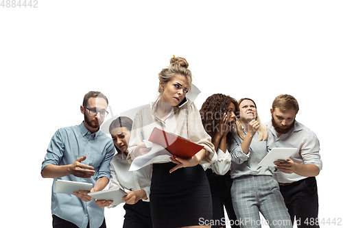 Image of Nervous tensioned investors analyzing crisis stock market with charts on screen of their gadgets