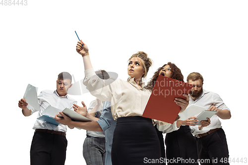 Image of Nervous tensioned investors analyzing crisis stock market with charts on screen of their gadgets