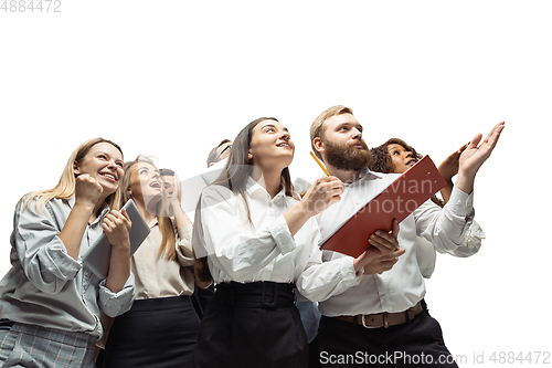 Image of Hopeful and happy investors analyzing crisis stock market with charts on screen of their gadgets