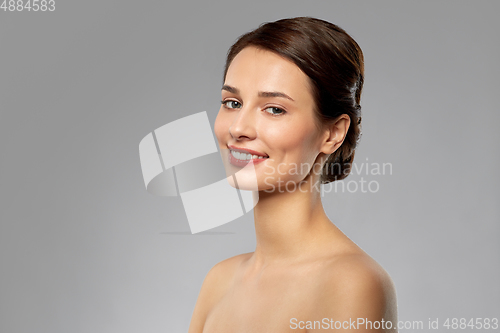 Image of beautiful young woman with bare shoulders