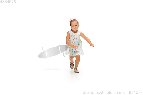 Image of Happy little caucasian girl jumping and running isolated on white background