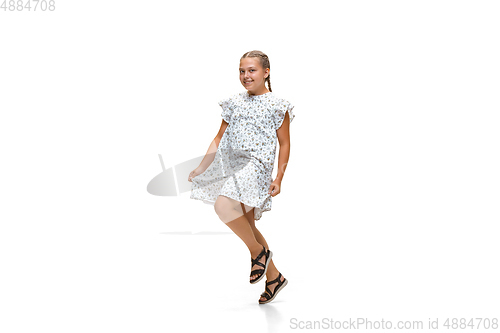 Image of Happy little caucasian girl jumping and running isolated on white background