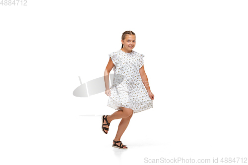 Image of Happy little caucasian girl jumping and running isolated on white background