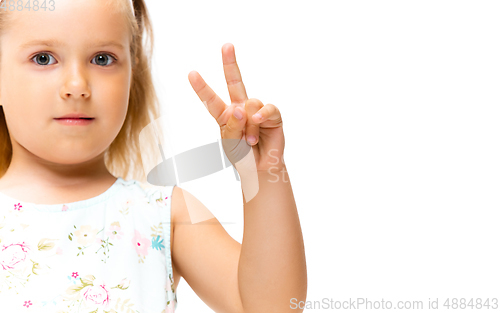 Image of Little girl gesturing isolated on white studio background with copyspace