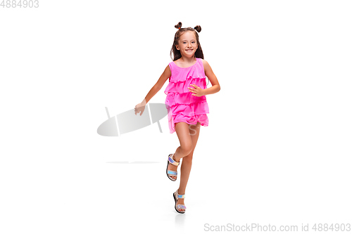Image of Happy little caucasian girl jumping and running isolated on white background