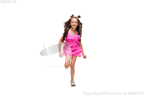 Image of Happy little caucasian girl jumping and running isolated on white background