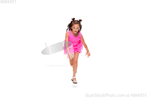 Image of Happy little caucasian girl jumping and running isolated on white background