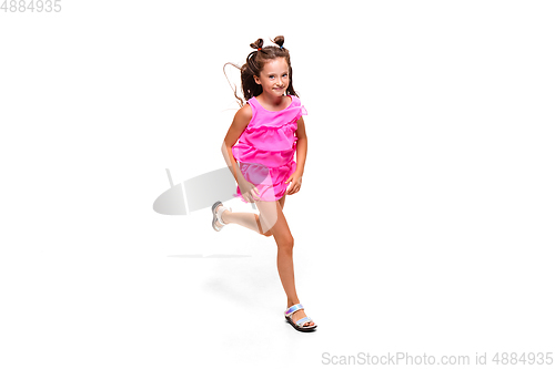 Image of Happy little caucasian girl jumping and running isolated on white background