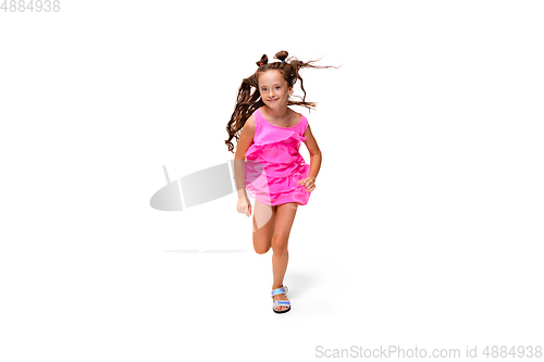 Image of Happy little caucasian girl jumping and running isolated on white background