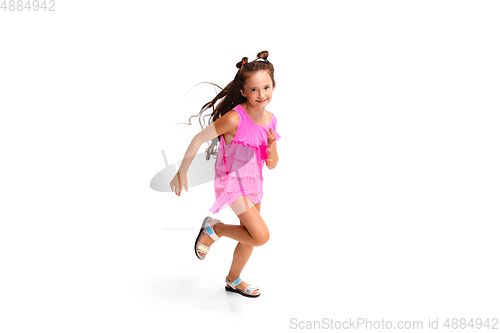 Image of Happy little caucasian girl jumping and running isolated on white background