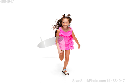 Image of Happy little caucasian girl jumping and running isolated on white background