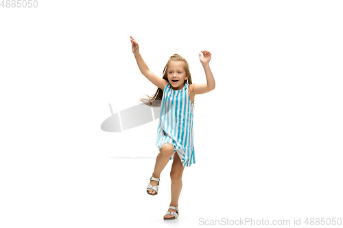 Image of Happy little caucasian girl jumping and running isolated on white background