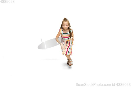 Image of Happy little caucasian girl jumping and running isolated on white background