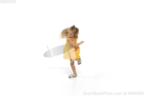 Image of Happy little caucasian girl jumping and running isolated on white background
