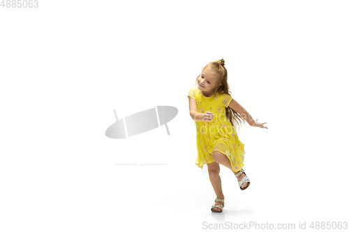 Image of Happy little caucasian girl jumping and running isolated on white background