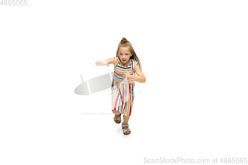 Image of Happy little caucasian girl jumping and running isolated on white background