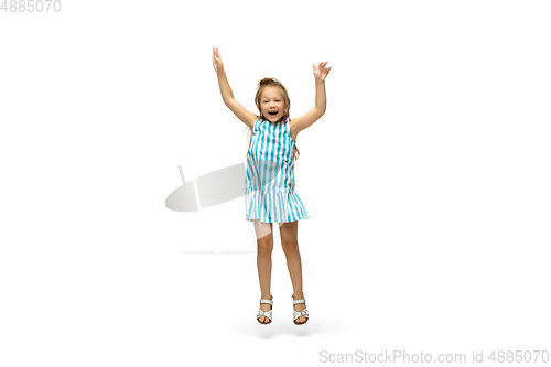 Image of Happy little caucasian girl jumping and running isolated on white background