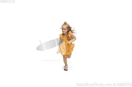 Image of Happy little caucasian girl jumping and running isolated on white background