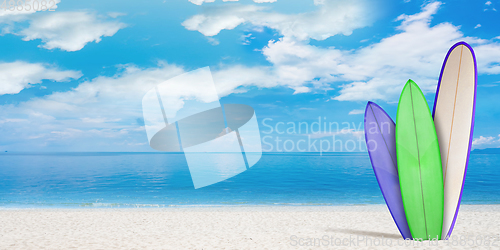 Image of Summer concept flyer. Surfing boards with beach, sand and ocean or sea on background