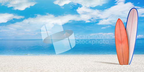 Image of Summer concept flyer. Surfing boards with beach, sand and ocean or sea on background