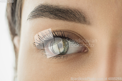 Image of Close up of face of beautiful caucasian young woman, focus on eyes. Human emotions, facial expression, cosmetology, body and skin care concept.