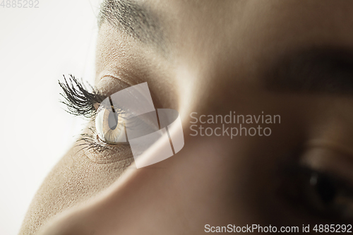 Image of Close up of face of beautiful caucasian young woman, focus on eyes. Human emotions, facial expression, cosmetology, body and skin care concept.