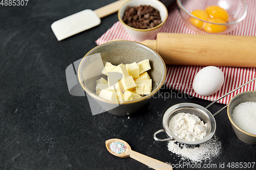 Image of rolling pin, butter, eggs, flour and chocolate