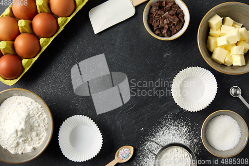 Image of rolling pin, butter, eggs, flour and chocolate