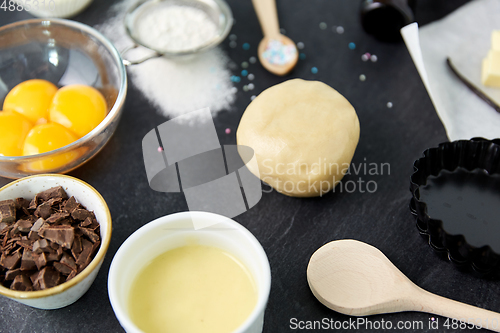 Image of dough, baking dish and cooking ingredients