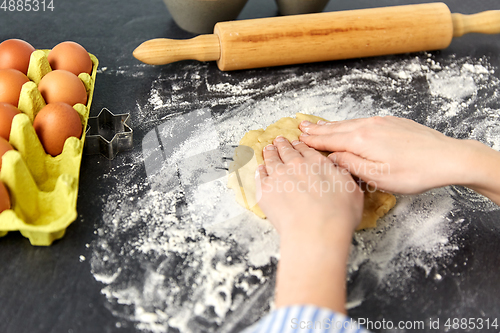 Image of hands making shortcrust pastry dough on table