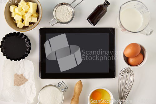 Image of tablet computer and cooking ingredients on table