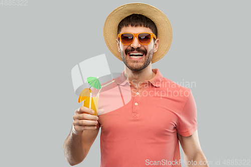 Image of happy man in straw hat with orange juice cocktail