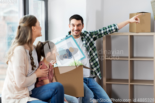 Image of happy family with child moving to new home