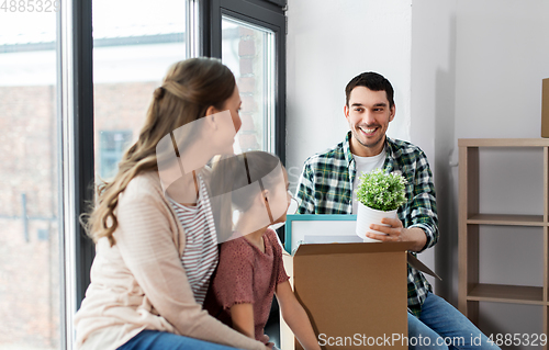 Image of happy family with child moving to new home