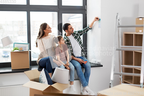 Image of happy family with color palette moving to new home