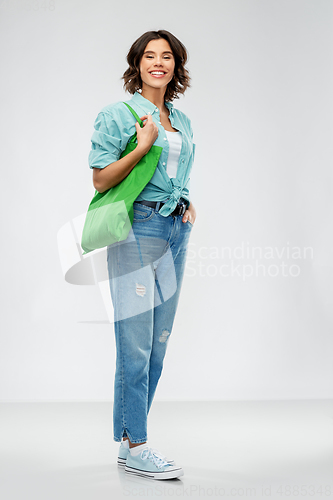 Image of woman with reusable canvas bag for food shopping