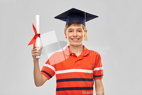 Image of graduate student boy in mortarboard with diploma
