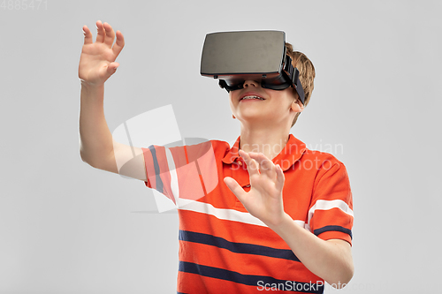 Image of portrait of happy smiling boy in vr glasses