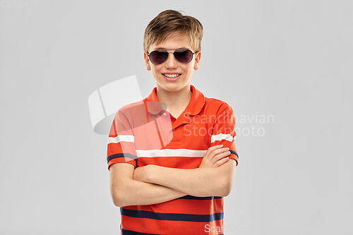 Image of portrait of happy smiling boy in sunglasses