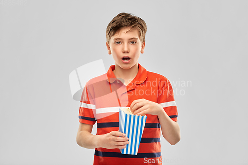 Image of boy eating popcorn
