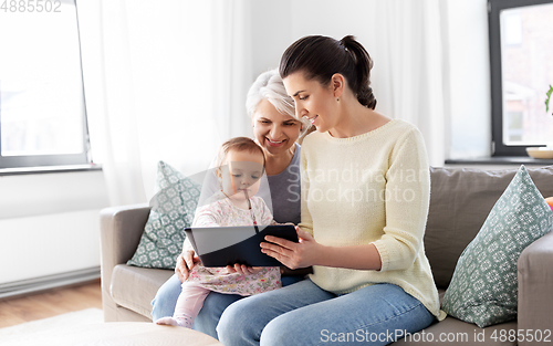 Image of mother, daughter and grandma with tablet pc