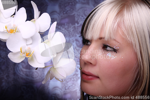 Image of Woman and orchid