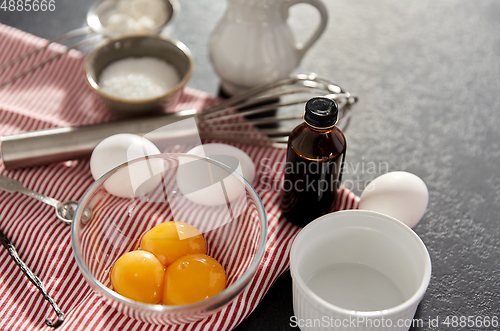 Image of whisk, eggs, sugar, milk, flour and vanilla