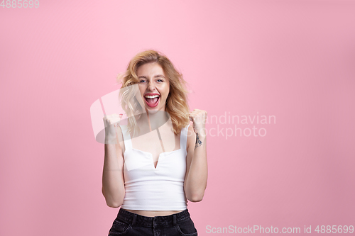 Image of Caucasian young woman\'s portrait isolated on pink studio background. Beautiful female model. Concept of human emotions, facial expression, sales, ad, youth culture.